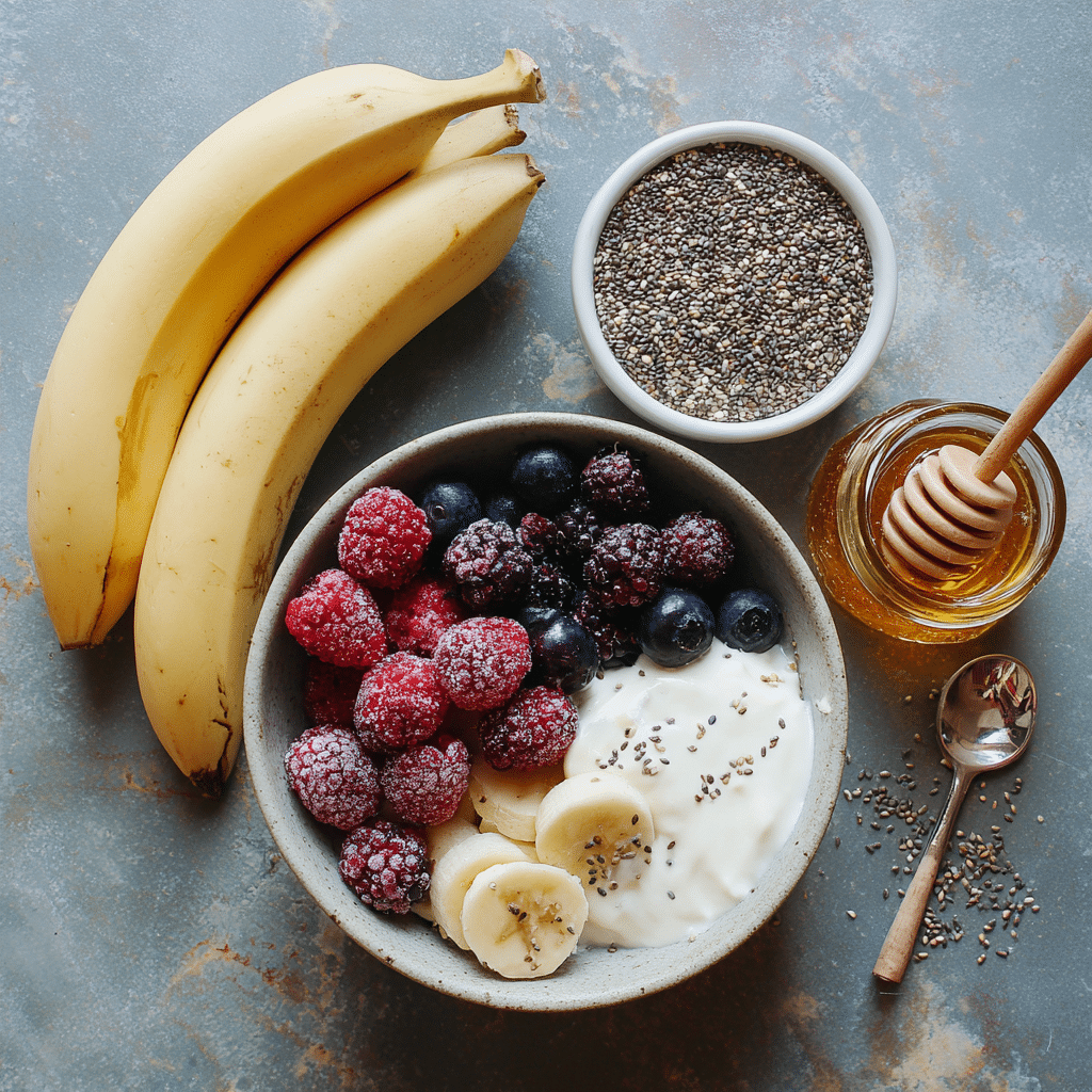 Ingredients for making 5-Minute Fruit Smoothie Bowl with yogurt, fruit, and honey